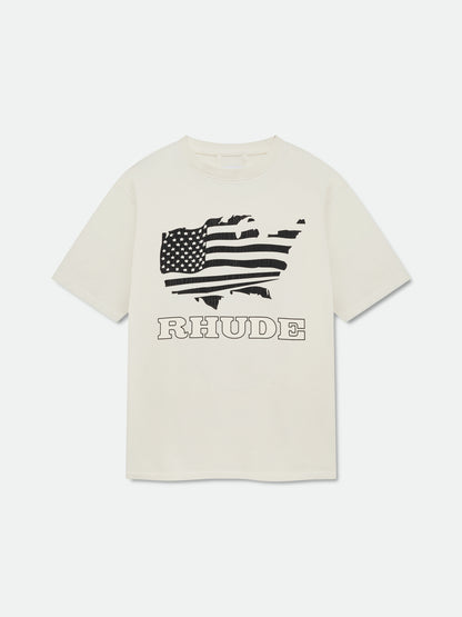 Vintage white tee with a black waving American flag graphic above outline RHUDE lettering, front view