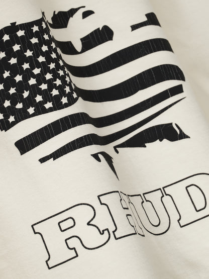 Angled close-up of the cracked black stars and stripes print on the vintage white tee