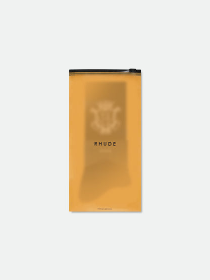 Rhude crest socks in their translucent orange zip packaging with a RHUDE logo