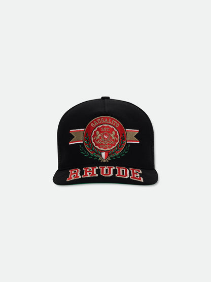 Black trucker hat with an embroidered red Sausalito crest and red RHUDE lettering across the brim, front view