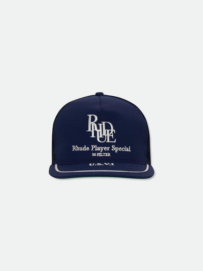 Navy trucker hat with a white embroidered RHUDE monogram, “Rhude Player Special” text and white brim piping, front view