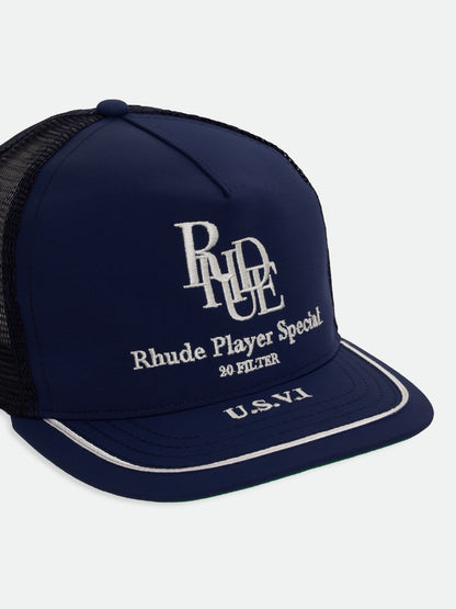 Navy Player Special trucker hat with white embroidery and piped brim, three-quarter view