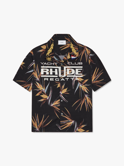 Black short-sleeve shirt with a bird of paradise print, gold laurel collar and cream RHUDE Regatta graphic, front view