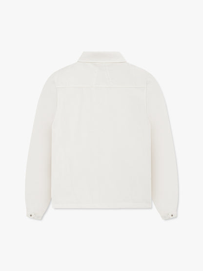 White coaches jacket, back view with a yoke seam and snap cuffs