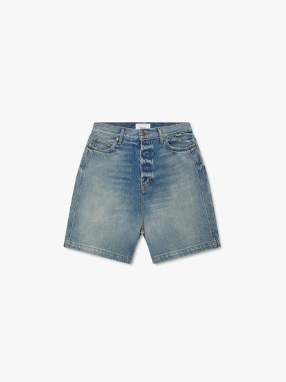 Faded indigo boxy denim shorts with a vintage wash, whiskering and button fly, front view