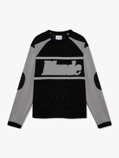 Black mesh long-sleeve moto shirt with grey raglan sleeves and stripes, a large grey Rhude logo and elbow patches, front view