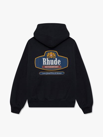 Black hoodie, back view with a large Rhude Motorsport crest graphic and “79éme Grand Prix de Monaco” banner