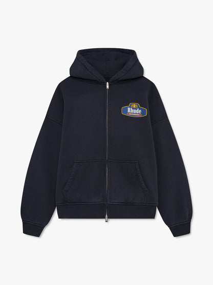 Vintage black zip-up hoodie with a full zip, small Rhude Motorsport chest badge and front pockets, front view