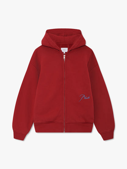 Red full-zip hoodie with sky blue script Rhude embroidery near the hem, front view