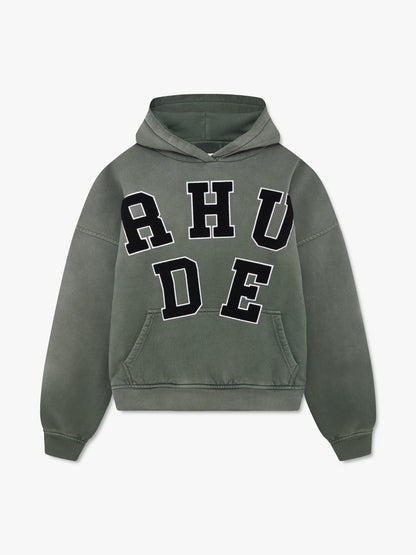 Washed olive hoodie with large black chenille RHUDE letter patches with white edging and a front pouch pocket, front view