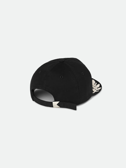 Black Champions cap, back view showing the adjustable strap with a metal clasp