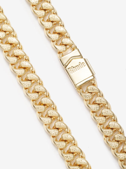 Close-up of the Rhude engraved box clasp between two lengths of paisley-patterned gold vermeil chain