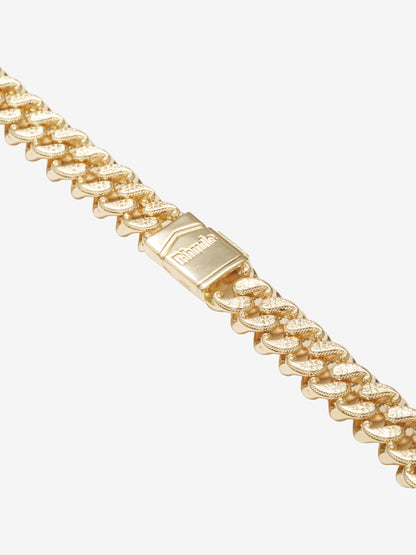 Angled close-up of the gold box clasp and paisley-textured curb links on the gold vermeil necklace