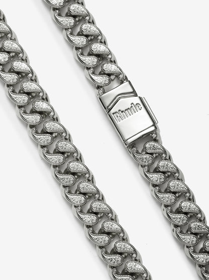 Close-up of the Rhude engraved box clasp and paisley-patterned links on the sterling silver necklace